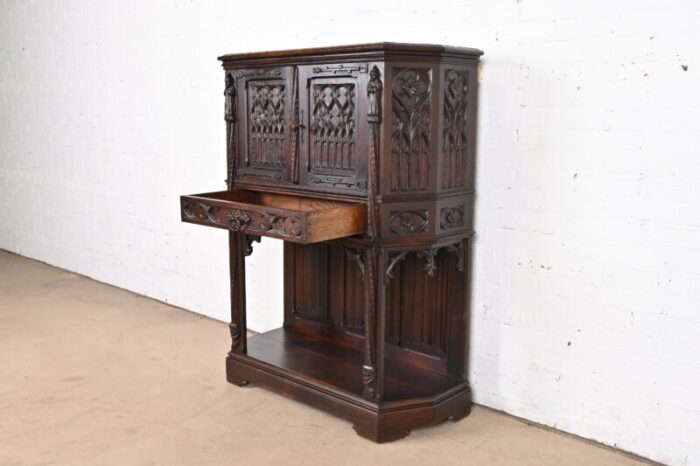 19th century belgian gothic revival carved dark oak bar cabinets pair 6741