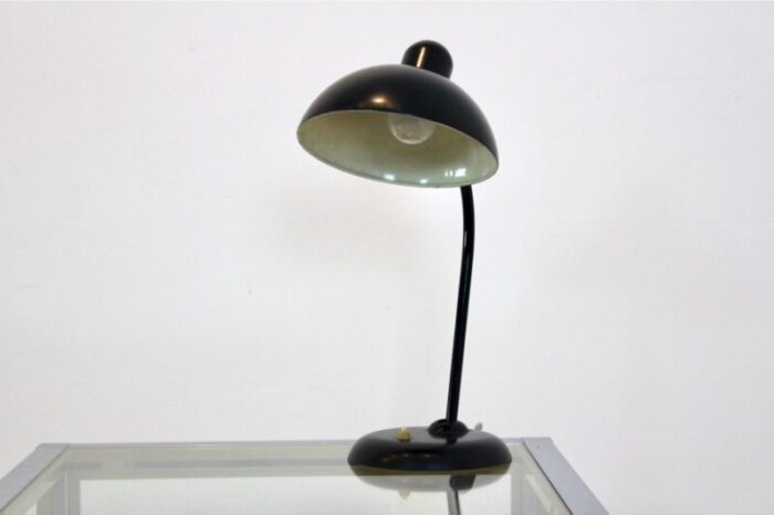 adjustable black steel table lamp attributed to christian dell for kaiser idell 1930s 1419