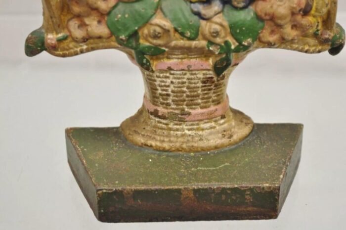 antique victorian cast iron painted floral bouquet pink bow basket door stop 1159