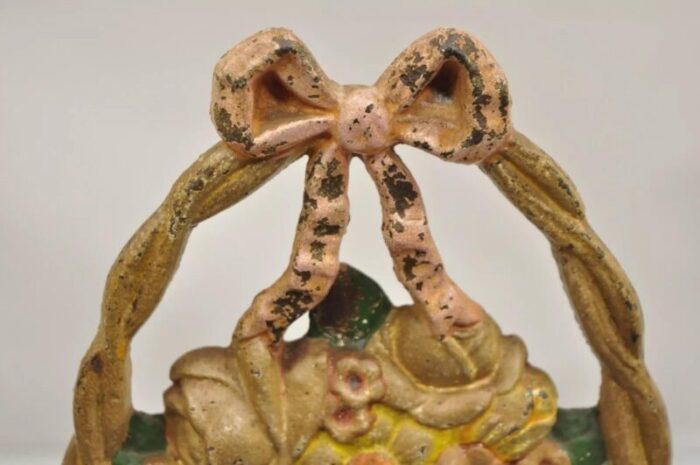 antique victorian cast iron painted floral bouquet pink bow basket door stop 5374