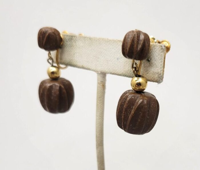 vintage 1960s signed napier goldtone wood carved beaded drop clip earrings 2 pieces 4548